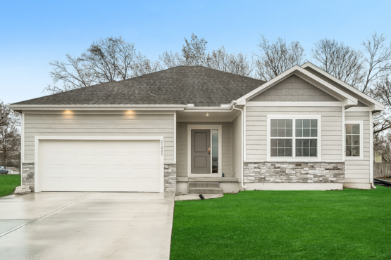 Modern home exterior with two-car garage and stone accents